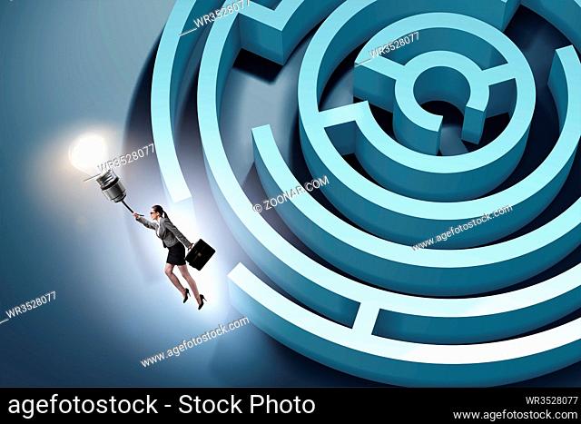 Businesswoman escaping from maze on balloon