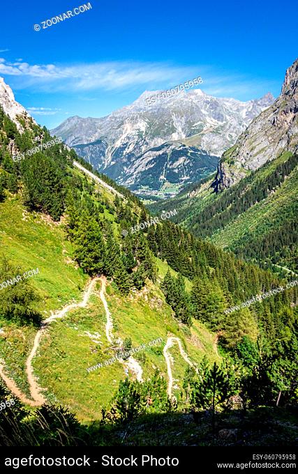Mountain and hiking path landscape in Pralognan la Vanoise national park. French alps