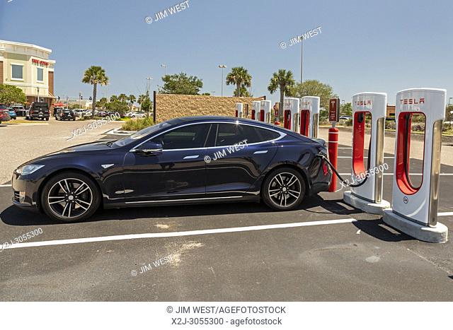 West Melbourne, Florida - A Tesla Model S charging at an electric car Supercharger station