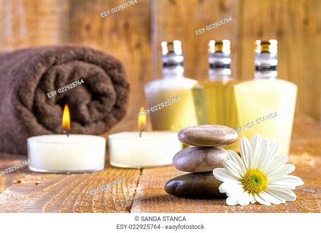 Zen basalt stones and spa oil with candles