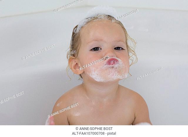 Little girl taking bath