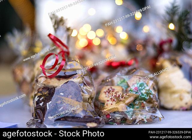 16 December 2023, Brandenburg, Leuthen: Pastries are on sale at a stall at a small Advent market. Advent and Christmas markets are also held in many German...