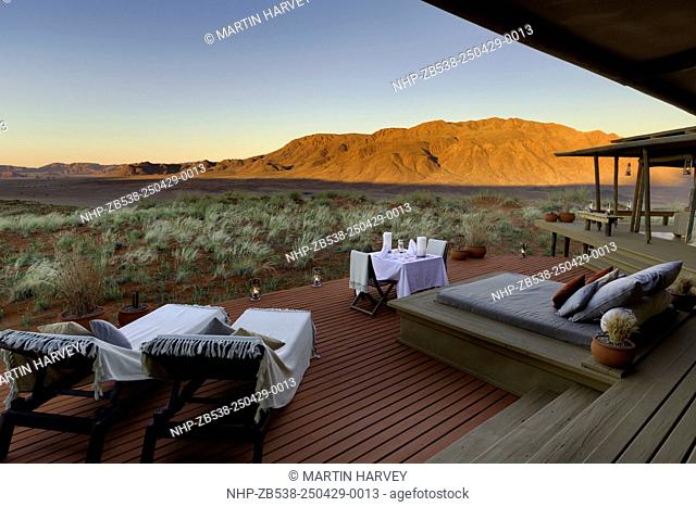 Romantic dining on deck area of mountain view suite.Dunes lodge.Wolwedans NamibRand Nature Reserve.Namibia