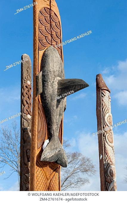 View of a killer whale (orca) on a carved wooden Ainu pole at the Ainu performance center in Ainu Kotan, which is a small Ainu village in Akankohan in Akan...