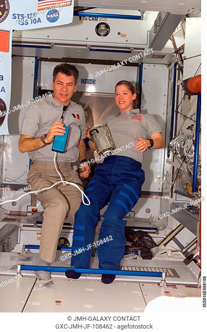 Astronauts Pam Melroy, STS-120 commander, and European Space Agency's (ESA) Paolo Nespoli, mission specialist, are pictured in the Harmony node of the...