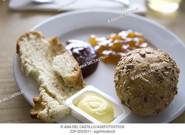 Breakfast with coffee bread butter and jam