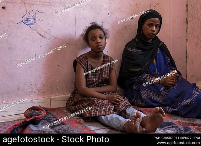 04 May 2023, Egypt, 6th of October City: A picture made available on 8 May 2023 shows Sudanese Naglaa Al-Aazz (R), 34, posing for a photo with her daughter...