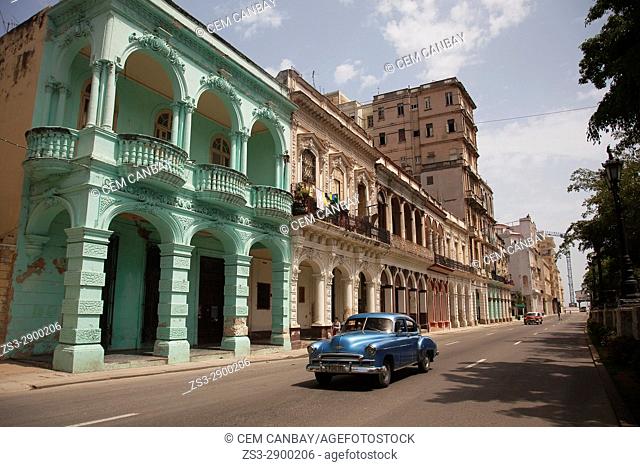 Old American car at the street in front of the colonial buildings in Central Havana, La Habana, Cuba, West Indies, Central America