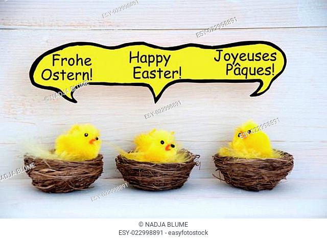 Three Chicks With Comic Speech Balloon With German French And English Happy Easter