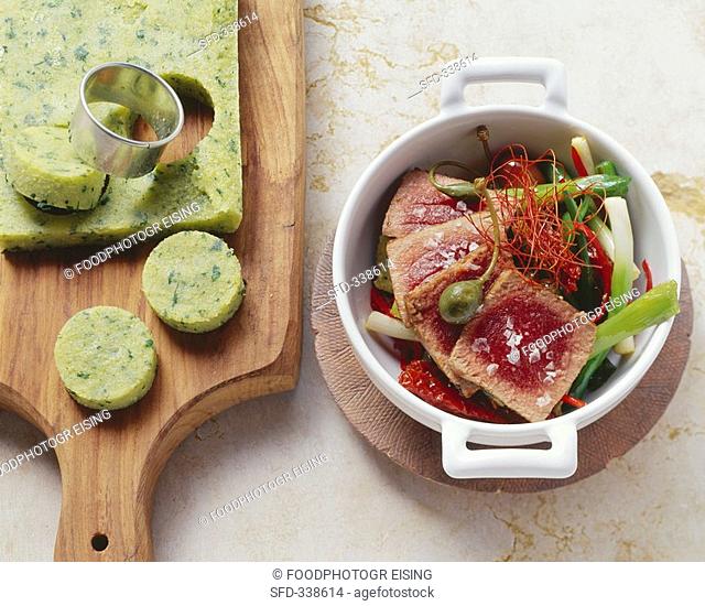 Tuna ragout with herb polenta