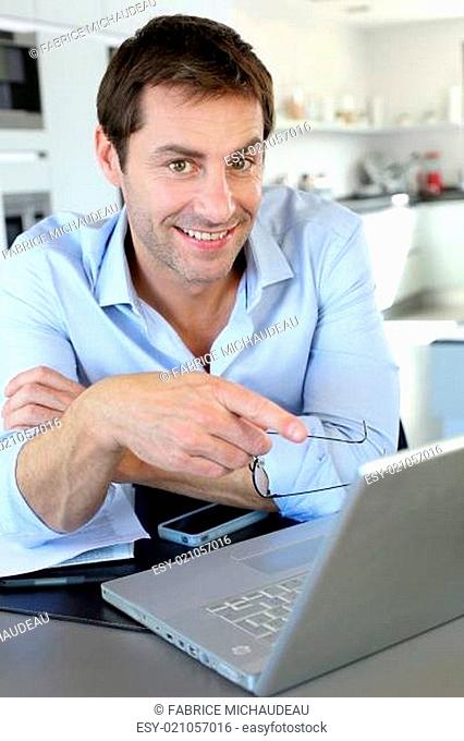 Portrait of businessman working from home