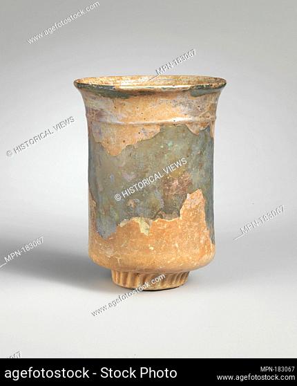 Glass beaker. Period: Late Imperial; Date: 4th century A.D; Culture: Roman; Medium: Glass; blown in a dip mold and trailed; Dimensions: H.: 4 3/8 in