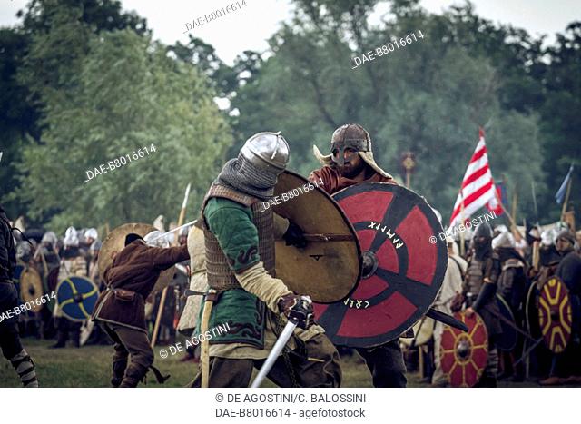 Warriors in battle with swords and shields, Festival of Slavs and Vikings, Centre of Slavs and Vikings, Jomsborg-Vineta, Wolin island, Poland