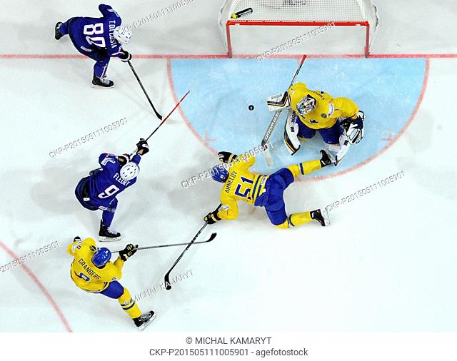 Damien Fleury of France, second left, scores as his teammate Teddy da Costa, left, Swedish goalkeeper Jhonas Enroth and his teammates Jonas Ahnelov and Petter...