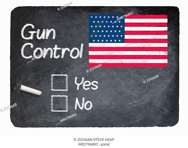 Gun Control choice using chalk on slate blackboard