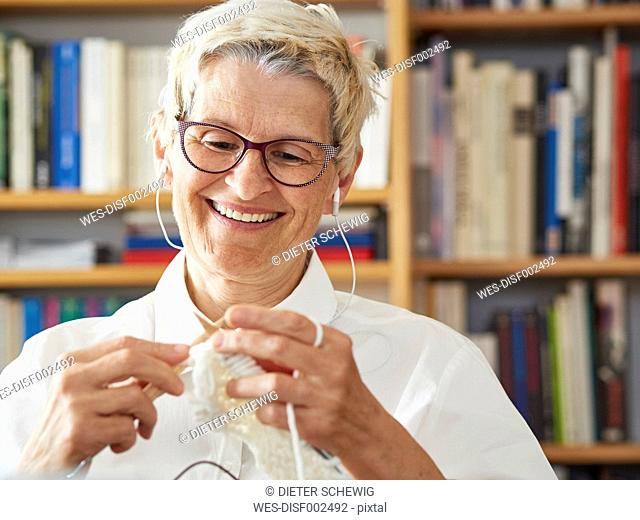 Portrait of knitting senior woman