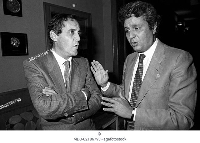 Two men talking at the 7th National Friendship Day. Fiuggi, September 1983