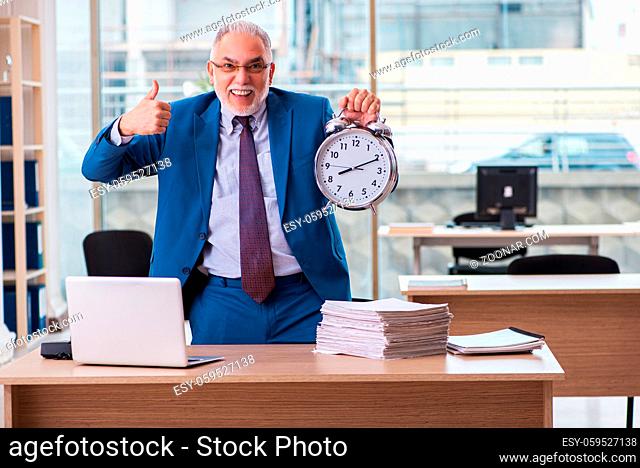 Old boss employee in time management concept