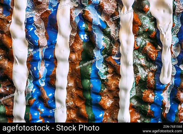 Colorful drops of wall painting macro texture background