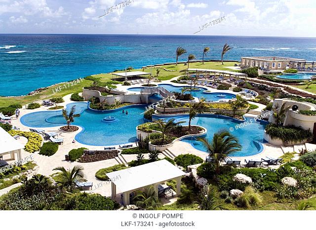 View over swimming pool area of the Crane Hotel, Atlantic Ocean in background, Barbados, Caribbean