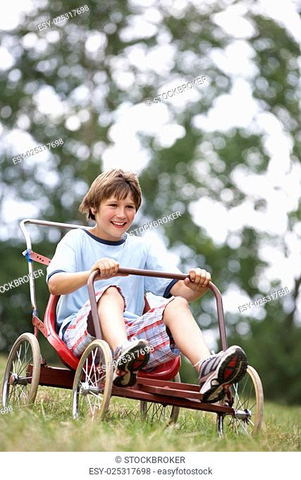Young boy playing with go-kart