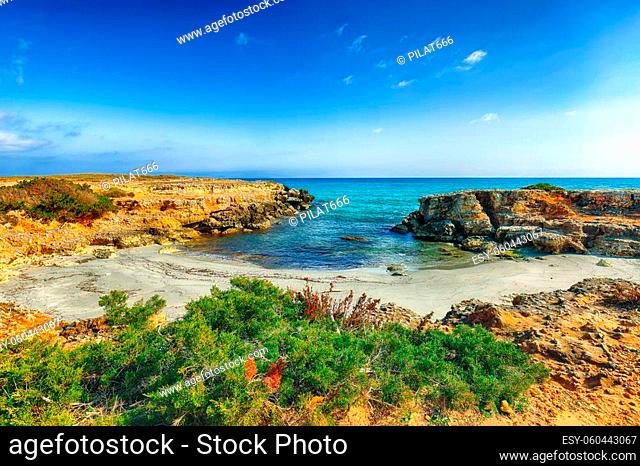 Picturesque seascape with white rocky cliffs, sea bay, islets and faraglioni near by Conca Specchiulla Beach, Salento Adriatic sea coast, Puglia, Italy