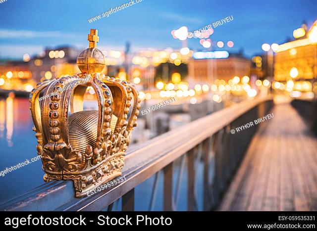Stockholm, Sweden. Skeppsholmsbron - Skeppsholm Bridge With Its Famous Golden Crown In Night Lights. Famous Popular Place Landmark Destination