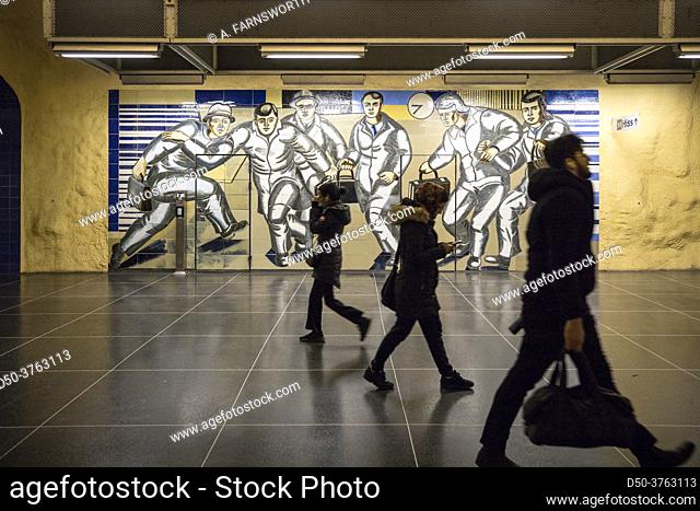 Stockholm, Sweden Passengers on the platform in the Akalla subway station in the Akalla suburb, mural designed by Birgit Ståhl-Nyberg