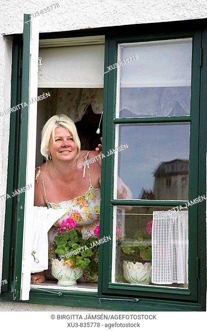 Blonde woman with window