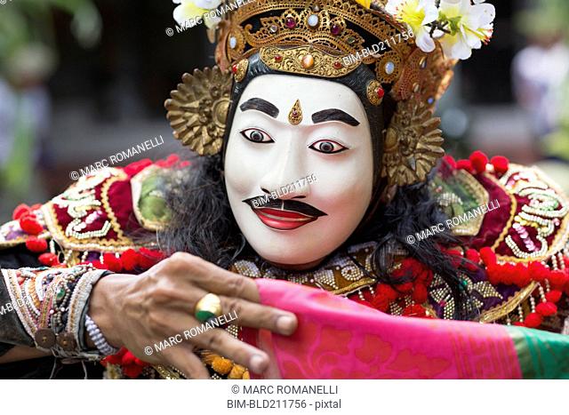 Balinese performer wearing mask and costume, Mas, Bali, Indonesia