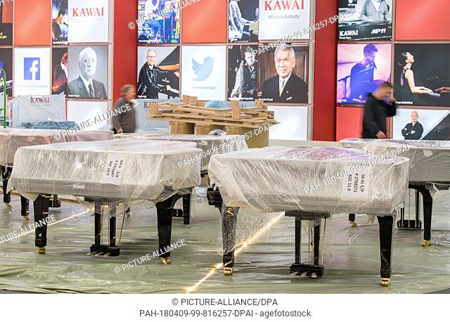 09 April 2018, Germany, Frankfurt/Main: Pianos of the Japanese manufacturer Kawai are yet to be unwrapped. The music fair and the 'Prolight+Sound' fair are...