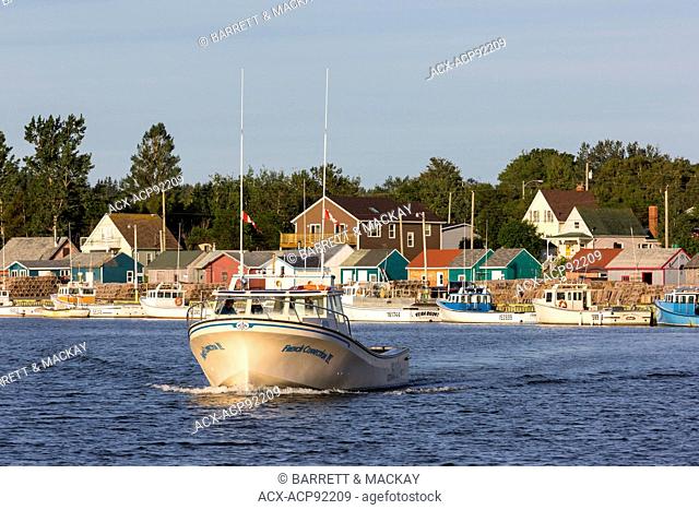Lobster boat leaving North Rustico Harbour, Prince Edward Island, Canada