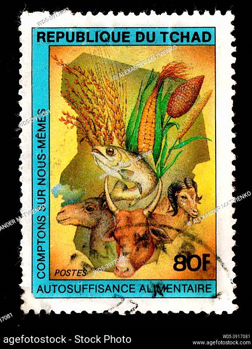 Chad - CIRCA 1982: Chad postage stamp about animals. Flora and fauna on postage stamp. Vintage stamp isolated on black. African animals depicted on postage...