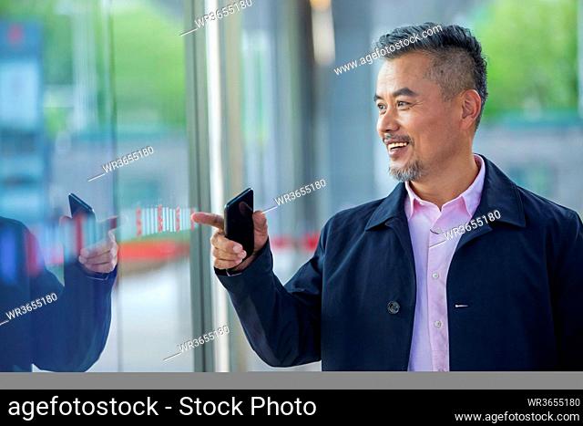Business men watch window reflection of himself