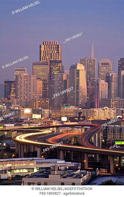 San Francisco, California, USA: financial district at sunrise, 280 freeway with car light trails, view from Potrero Hill