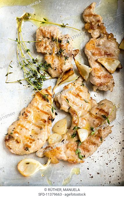 Grilled meat with garlic and thyme