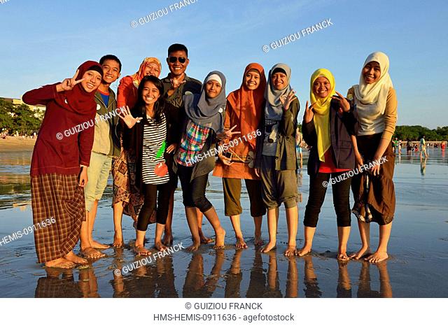 Indonesia, Bali, indonesian tourists on Kuta beach