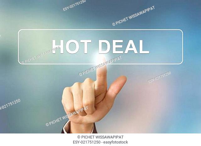 business hand clicking hot deal button on blurred background