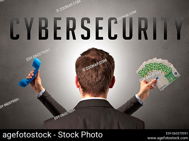 Rear view of a businessman with CYBERSECURITY inscription, cyber security concept