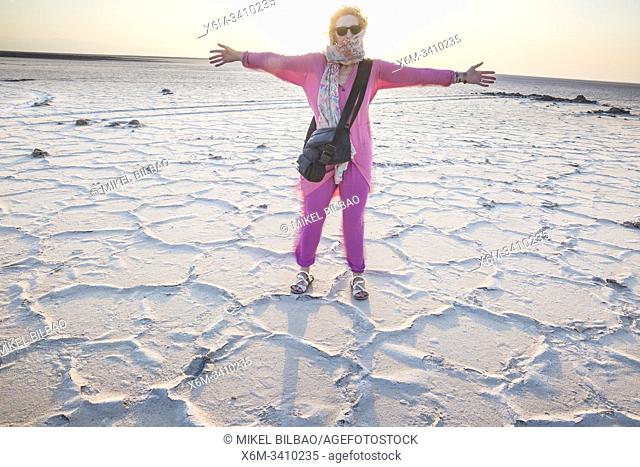 Woman on a salt lake. Namak Lake Qom (Salt Lake Qom). Maranjab. Iran, Asia