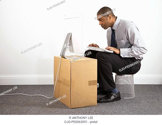Businessman working on makeshift desk