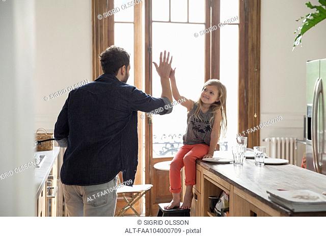 Father and daugther high-five