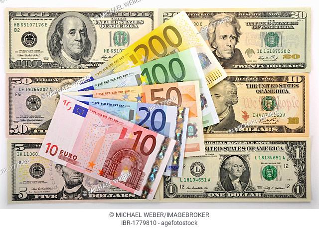 Symbolic image for exchange rate, U.S. dollar banknotes, euro banknotes fanned out