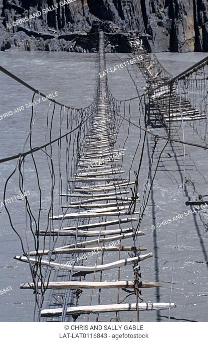 Bridges over rivers such as the Hunza in the Karakoram mountains are often very simple and flimsy structures, made of rope and small planks