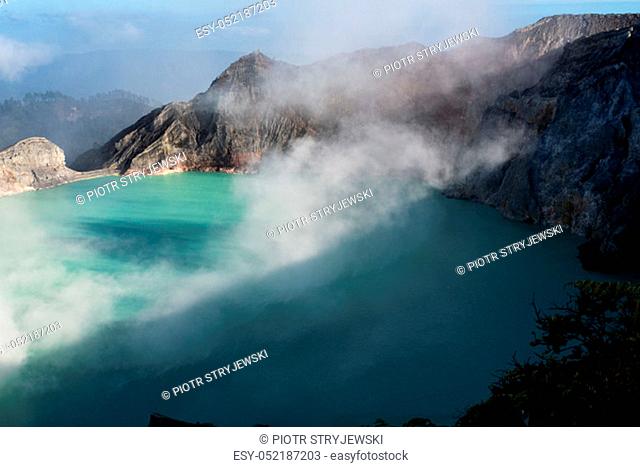 Aerial view of beautiful Ijen volcano with acid lake and sulfur gas going from crater, Indonesia