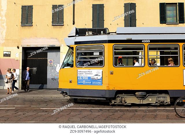 A typical tramcar stopped in front of building, Milan, Lombardy, Italy