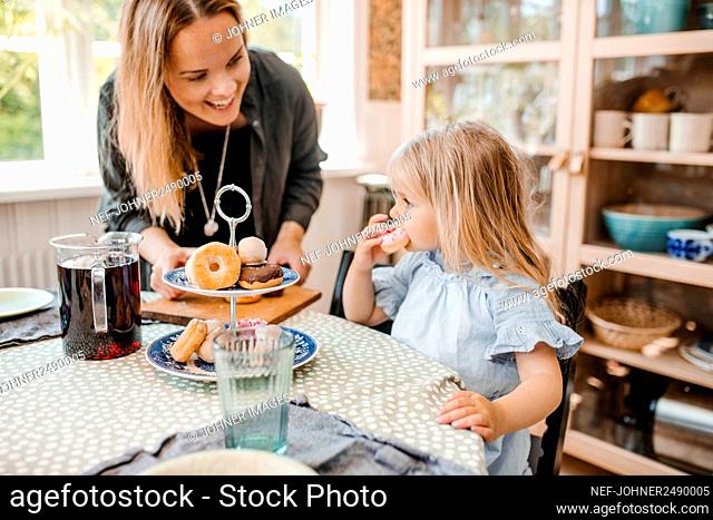 Mother with daughter in dining room