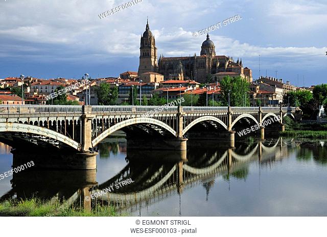 Europe, Spain, Castile and Leon, Salamanca, View of cathedral in city and bridge across Rio Tormes