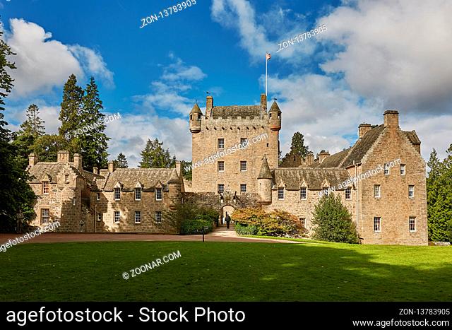 CAWDOR, NAIRN, SCOTLAND, UK - AUGUST 07, 2017: Front of Cawdor Castle with turret and drawbridge with bell and Stags Head Buckel Be Mindfull emblem