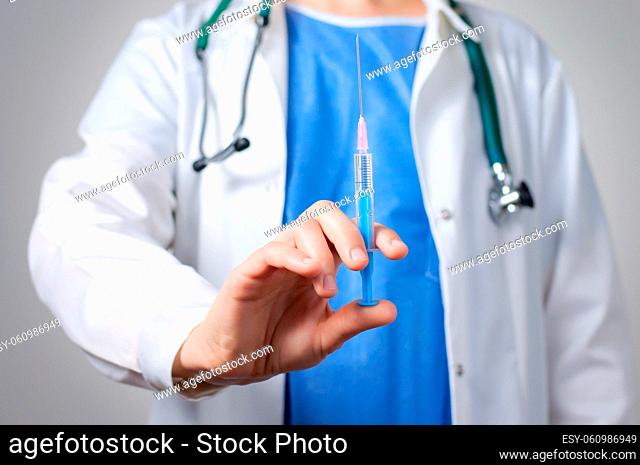 Closeup of a female doctor with syringe